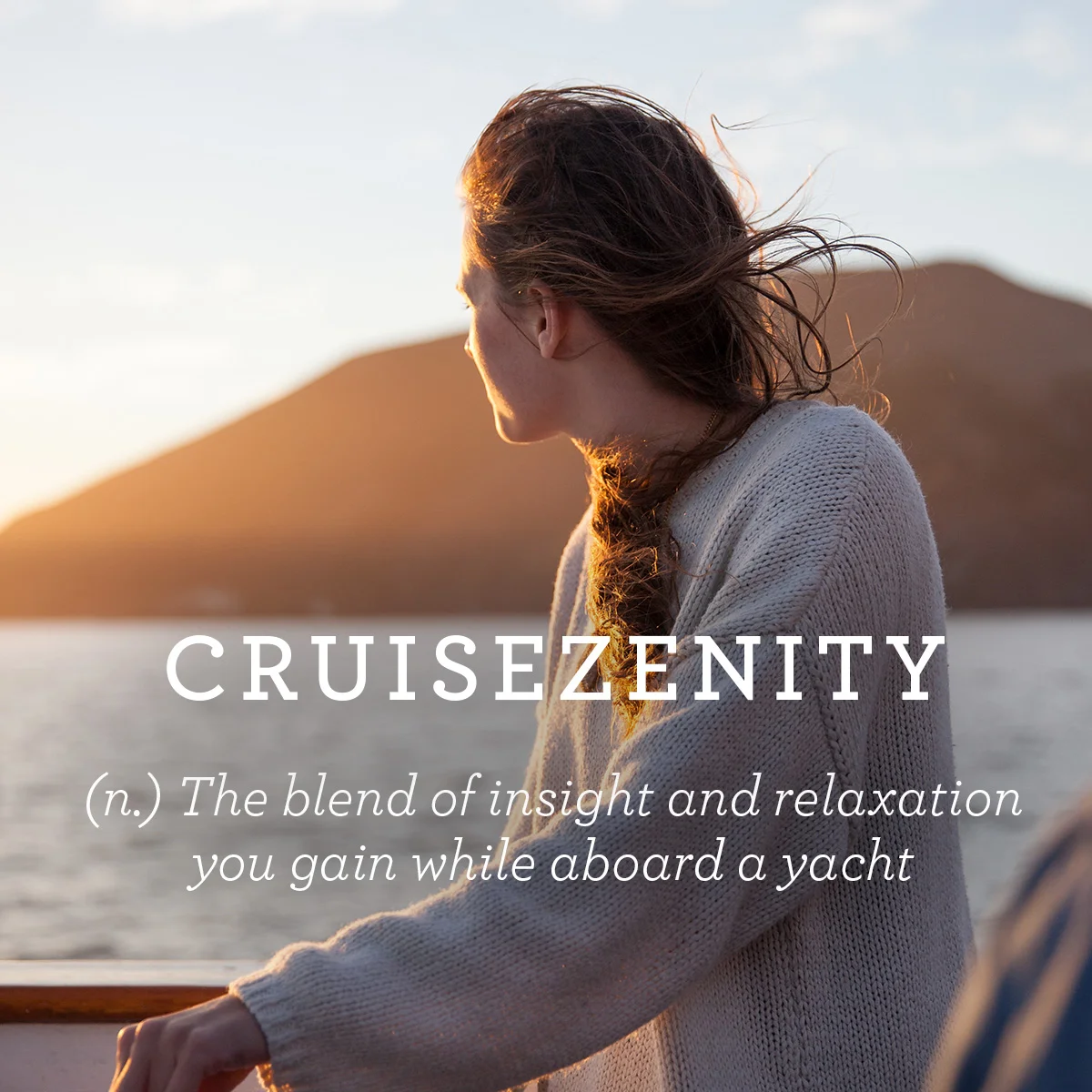 A woman in a sweater gazing at the sea and mountains during sunset, paired with the definition “Cruisezenity.” Copywriting by Paul Baker for Hornblower Cruises campaign.