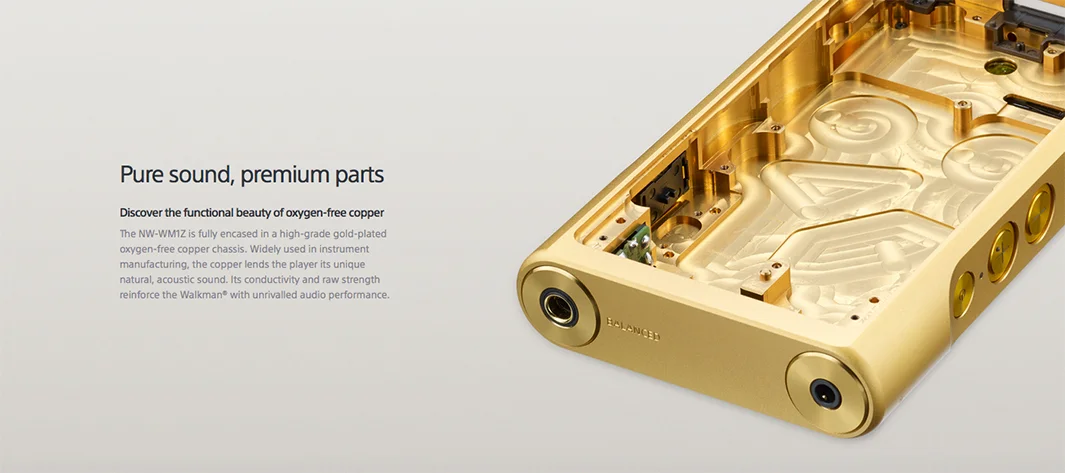 Close-up of the gold-plated copper chassis of the Sony Signature Series Walkman NW-WM1Z, showcasing oxygen-free copper interior. Portfolio copywriting by Paul Baker, emphasizing premium materials and acoustic performance.
