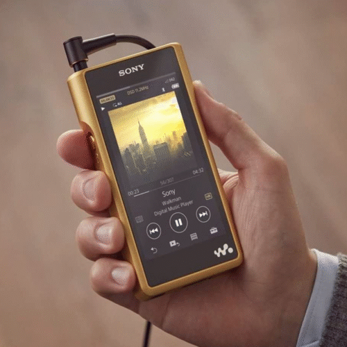 Hand holding a gold Sony Hi-Res Audio Walkman digital music player, displaying an album cover of a city skyline on the screen. Portfolio work by senior copywriter and strategist Paul Baker, who developed content strategy and messaging to introduce Sony’s Hi-Res Audio technology to consumers